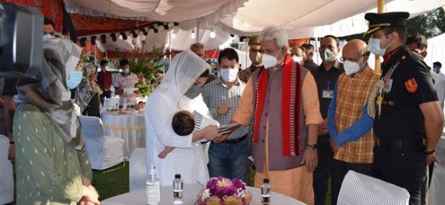 Lt Governor Sinha meets family members of Waseem Bari and Sajad Ahmad Khandey Lt Governor Sinha meets family members of Waseem Bari and Sajad Ahmad Khandey