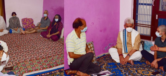 Lt Governor visits family of Councillor Rakesh Pandita, who was shot dead by militants Lt Governor visits family of Councillor Rakesh Pandita, who was shot dead by militants
