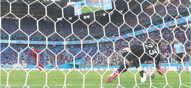 Simon saves lift Spain past Swiss on penalties to reach semis Simon saves lift Spain past Swiss on penalties to reach semis