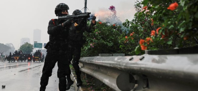 Police fire tear gas to disperse protest at Indonesian parliament